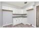 Bright kitchen featuring white cabinets, granite counters, and modern flooring at 166 N Post Rd, Indianapolis, IN 46219