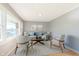 Comfortable living room area features neutral walls, hardwood floors, and ample natural light at 166 N Post Rd, Indianapolis, IN 46219