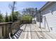 Back deck with a decorative pergola offers outdoor living space with wooded views at 1809 Ernest Ct, Indianapolis, IN 46234