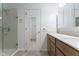 Bathroom with neutral paint and white trim featuring a tiled shower and single sink vanity at 1809 Ernest Ct, Indianapolis, IN 46234