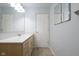 Bathroom vanity and mirror provide ample space with a clean, neutral aesthetic at 1809 Ernest Ct, Indianapolis, IN 46234