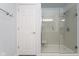 Bathroom showing glass shower enclosure with white door and coordinating neutral paint at 1809 Ernest Ct, Indianapolis, IN 46234