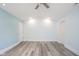 Spacious bedroom with vaulted ceilings, neutral paint, and light gray plank flooring at 1809 Ernest Ct, Indianapolis, IN 46234