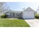 Charming single-story home featuring a two-car garage and well-maintained lawn at 1809 Ernest Ct, Indianapolis, IN 46234