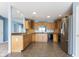 Well-lit kitchen with stainless steel refrigerator, black appliances, and beautiful cabinetry at 1809 Ernest Ct, Indianapolis, IN 46234