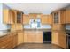 Kitchen featuring stainless steel appliances, wood cabinetry, and granite countertops at 1809 Ernest Ct, Indianapolis, IN 46234
