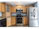 View of modern kitchen with stainless steel oven, microwave, and refrigerator at 1809 Ernest Ct, Indianapolis, IN 46234