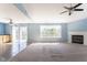 Spacious living room with fireplace, wet bar, and sliding door access to the backyard at 1809 Ernest Ct, Indianapolis, IN 46234