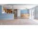 Open-concept living area flowing into a kitchen with stainless steel appliances at 1809 Ernest Ct, Indianapolis, IN 46234