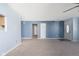 Bright living room featuring neutral carpet and light blue walls at 1809 Ernest Ct, Indianapolis, IN 46234