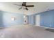 Open living room area featuring neutral carpet and light blue walls at 1809 Ernest Ct, Indianapolis, IN 46234