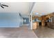 Bright, open concept living room and kitchen area with stainless steel appliances and ample space at 1809 Ernest Ct, Indianapolis, IN 46234