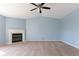Living room featuring a cozy fireplace, neutral carpet, and light blue walls at 1809 Ernest Ct, Indianapolis, IN 46234
