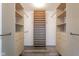 Bright walk-in closet with custom shelving and drawers for optimal organization and clothing storage at 1809 Ernest Ct, Indianapolis, IN 46234