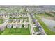Expansive aerial view of a neighborhood showcasing well-maintained homes, green spaces, and community ponds at 1973 Mobley Dr, Westfield, IN 46074