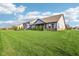 Lush green backyard features well-kept grass with privacy landscaping at 1973 Mobley Dr, Westfield, IN 46074