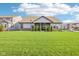 Well-manicured backyard with healthy green lawn and privacy landscaping at 1973 Mobley Dr, Westfield, IN 46074