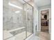 Spacious bathroom featuring a glass-enclosed shower with a built-in bench and walk-in closet at 1973 Mobley Dr, Westfield, IN 46074