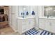 Modern bathroom with double vanity, white cabinets, and stylish blue accents at 1973 Mobley Dr, Westfield, IN 46074