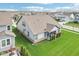 Back of home featuring covered porch, manicured landscaping, and lush green lawn at 1973 Mobley Dr, Westfield, IN 46074