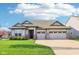 Charming one-story home with a well-manicured lawn, attached two-car garage, and neutral color scheme at 1973 Mobley Dr, Westfield, IN 46074