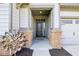 The front entryway has a black front door, brick pillars, and a decorative yard decoration at 1973 Mobley Dr, Westfield, IN 46074
