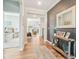 Inviting hallway with stylish decor, console table, and views into other living spaces at 1973 Mobley Dr, Westfield, IN 46074