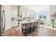 Modern kitchen with stainless steel appliances, a large island, and an adjacent dining area at 1973 Mobley Dr, Westfield, IN 46074
