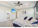 Large main bedroom with TV and ceiling fan, leading to an ensuite bathroom at 1973 Mobley Dr, Westfield, IN 46074