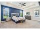 Spacious main bedroom with tray ceiling, ensuite, and backyard views from the multiple windows at 1973 Mobley Dr, Westfield, IN 46074