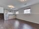 Spacious basement with wood floors, a bar with brickwork, and natural light from basement windows at 212 Westridge Blvd, Greenwood, IN 46142