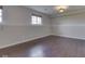 Open basement area featuring vinyl plank flooring and neutral paint, offering a versatile space at 212 Westridge Blvd, Greenwood, IN 46142