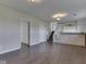 Basement featuring vinyl flooring, stairs, and bar at 212 Westridge Blvd, Greenwood, IN 46142