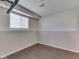 View of finished basement with wood floors, a window, and white trim at the floor and ceiling at 212 Westridge Blvd, Greenwood, IN 46142