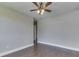 Spacious room with wood-look flooring, neutral paint, and modern ceiling fan at 212 Westridge Blvd, Greenwood, IN 46142