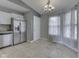Bright dining area features neutral tile flooring and ample natural light at 212 Westridge Blvd, Greenwood, IN 46142