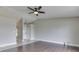 Living room boasts hardwood floors and ceiling fan at 212 Westridge Blvd, Greenwood, IN 46142