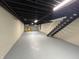 Finished basement features a table, two chairs and stairs leading to the upper floor at 2135 Union St, Columbus, IN 47201