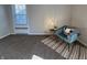 Bedroom showcasing a comfortable armchair with a small table and a patterned rug at 2135 Union St, Columbus, IN 47201