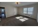Bedroom featuring a window with blinds, a closet door and neutral walls and carpet at 2135 Union St, Columbus, IN 47201