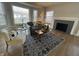Bright living room with wood floors, a decorative fireplace, and stylish furnishings at 2135 Union St, Columbus, IN 47201