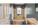 Bathroom featuring a tub with shower, sink, and toilet at 2219 N Webster Ave, Indianapolis, IN 46219