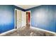 Bedroom with damaged walls and closet at 2219 N Webster Ave, Indianapolis, IN 46219