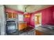 Kitchen with dark countertop, oven, and wooden cabinets offering ample storage space at 2219 N Webster Ave, Indianapolis, IN 46219