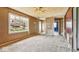 Bright living room featuring a large window, neutral walls, and access to other rooms in the home at 2219 N Webster Ave, Indianapolis, IN 46219