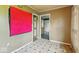 Room with vintage tile flooring, bright lighting, and an adjacent room at 2219 N Webster Ave, Indianapolis, IN 46219