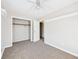 Bedroom featuring neutral paint, carpet, a spacious closet, and bright natural light at 225 E 36Th St, Anderson, IN 46013