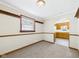 Well-lit dining room features neutral carpet and decorative wood trim at 225 E 36Th St, Anderson, IN 46013