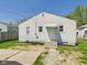 Charming single-story home with a well-maintained exterior, inviting front entrance, and small front yard at 225 E 36Th St, Anderson, IN 46013