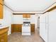 Functional kitchen with linoleum flooring, white appliances, and a classic layout at 225 E 36Th St, Anderson, IN 46013
